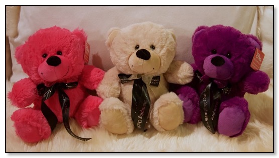 Picture of pink, beige, and purple Teddy Bears wearing Connections Matter ribbons to advocate stamping out stigma. 