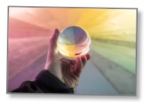 Picture of a person’s hand holding an orb to communicate an alternate perspective 