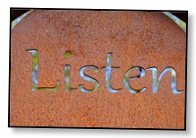 Picture of the word ‘listen’ etched in silver on a copper background