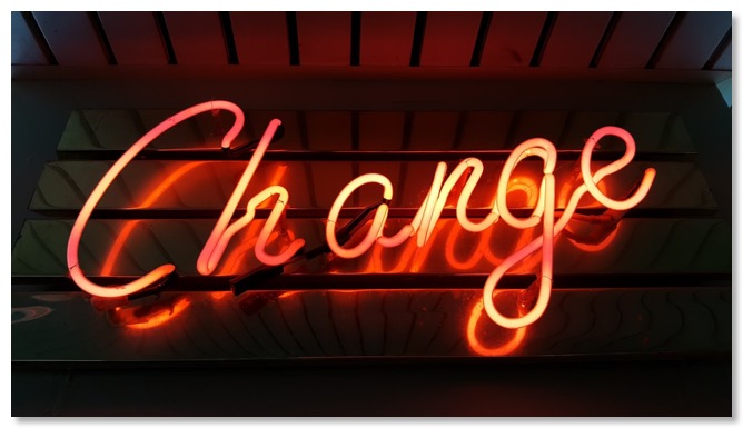 Picture of a neon light displaying the word 'change', communicating that with support healthy relationships are possible.